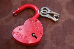 Unlocked love heart padlock with both keys to show Libras lack of boundaries with exes
